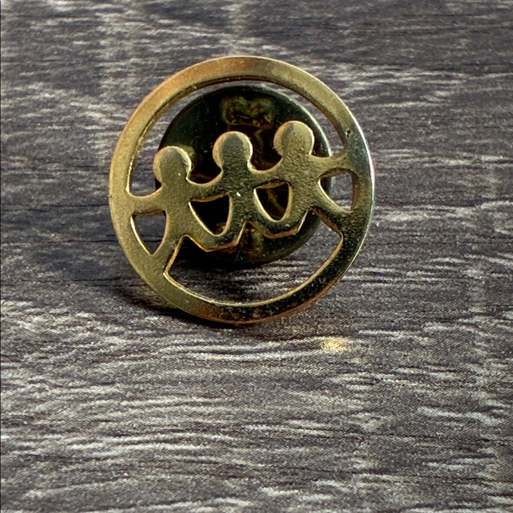 Gold Circle Pin with Figures